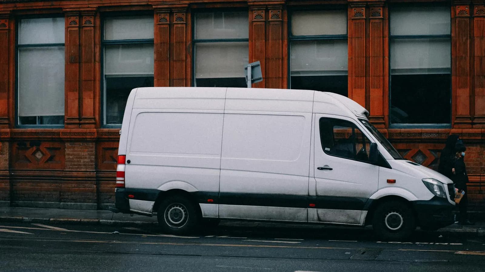 White work van parked on a residential street